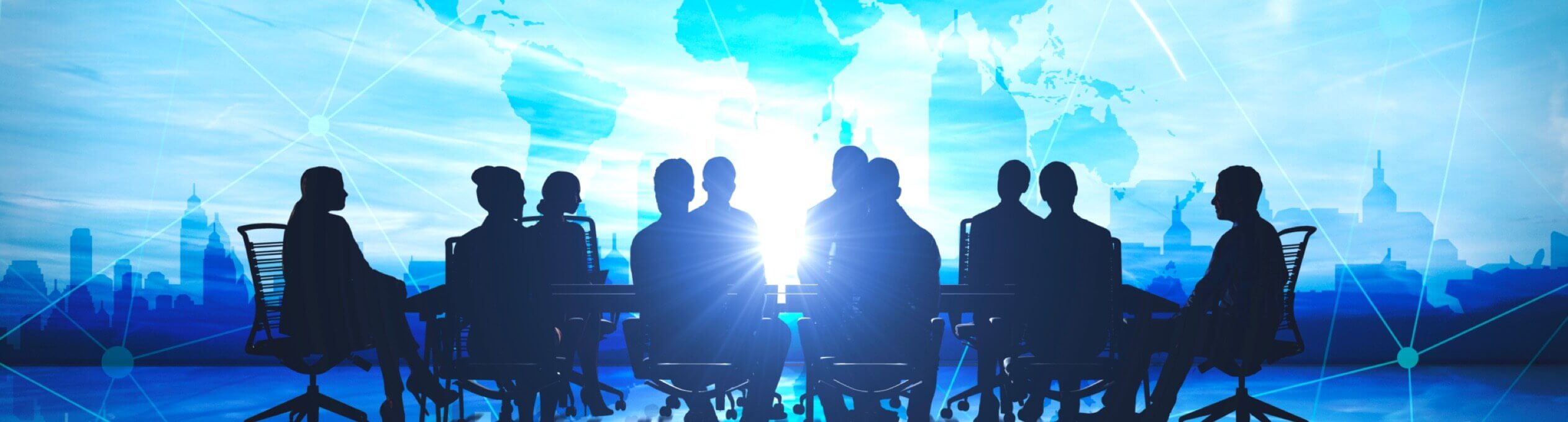 Silhouette of a group of businesspeople seated at a table against a modern blue globe background.