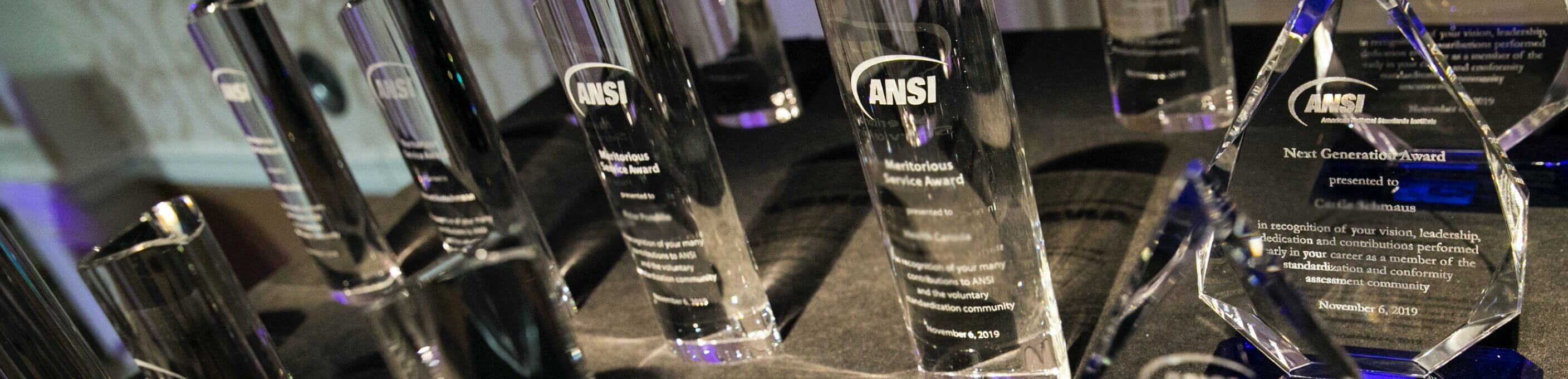 Closeup of ANSI Award crystals on a black table.