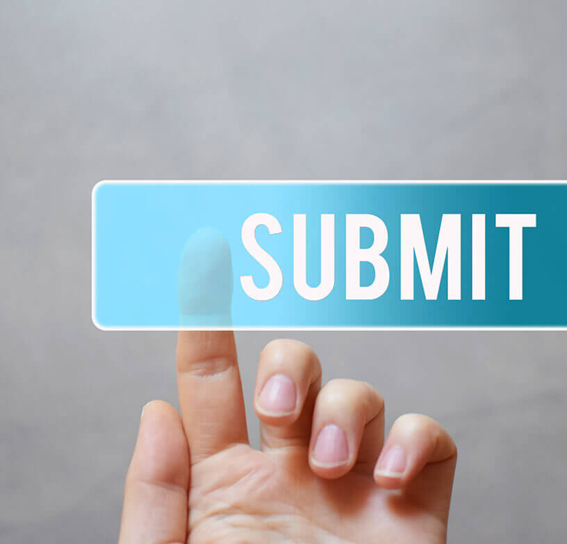 Hand pressing a teal submit button 